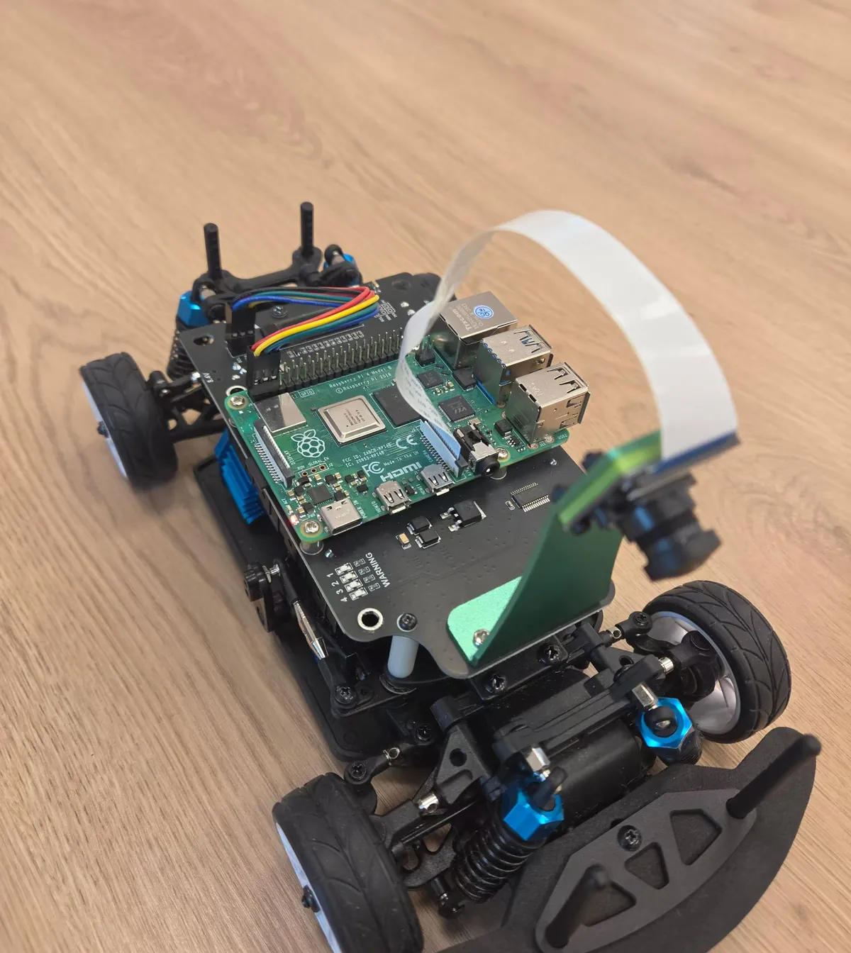 The robot car with a Raspberry Pi and a camera